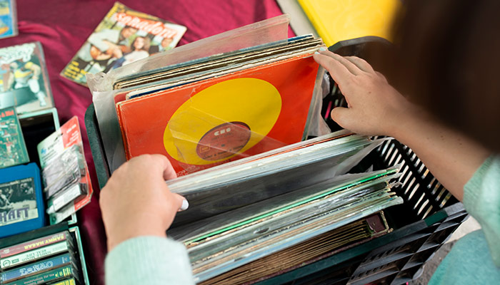 woman browsing through a collection of vinyl records