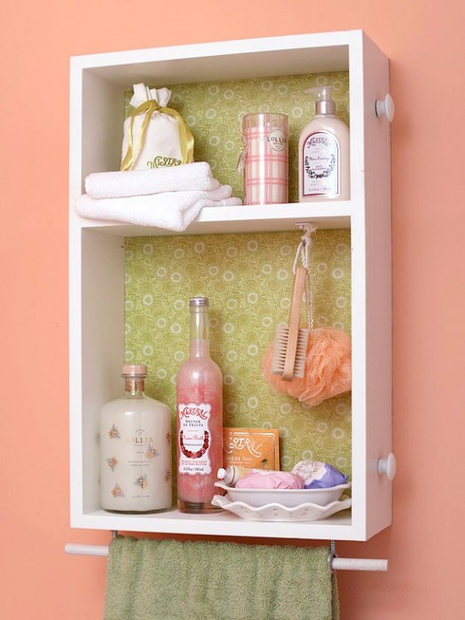 an upcycled old drawer as a bathroom wall-mounted mini storage unit