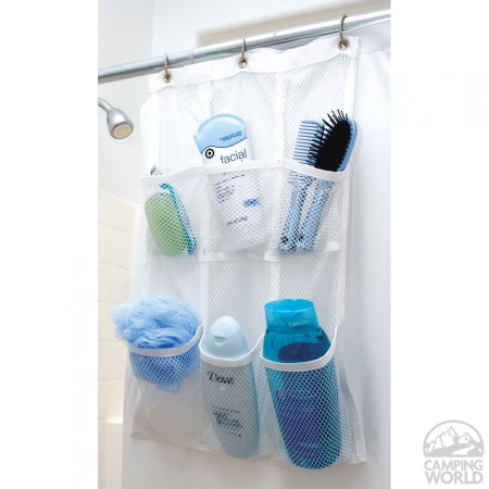 a shower pocket organizer is hanging on a shower rod and storing a shaving razor, face scrub, dove body wash, and a comb, hair brush, loofah, and more