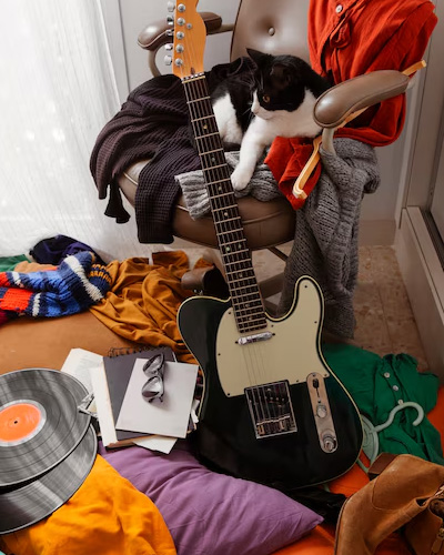 guitar in a messy room