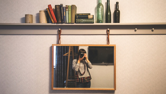 a woman taking a picture of herself