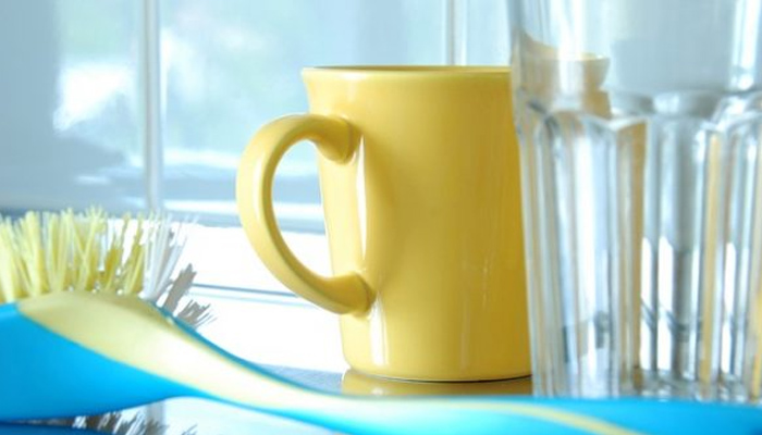 a yellow mug and a glass of water