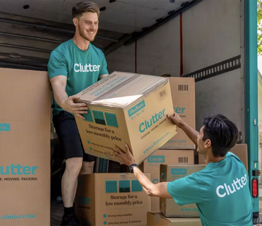 men with clutter moving boxes