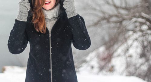 girl in winter coat in snow