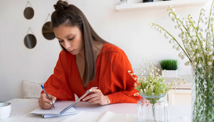 woman preparing checklist before a move