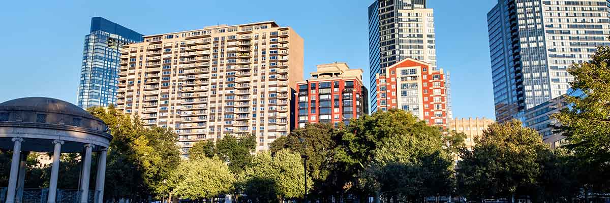 Cityscape of a park with people walking