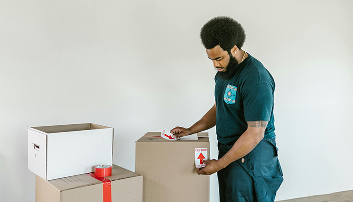 a person packing antique furniture