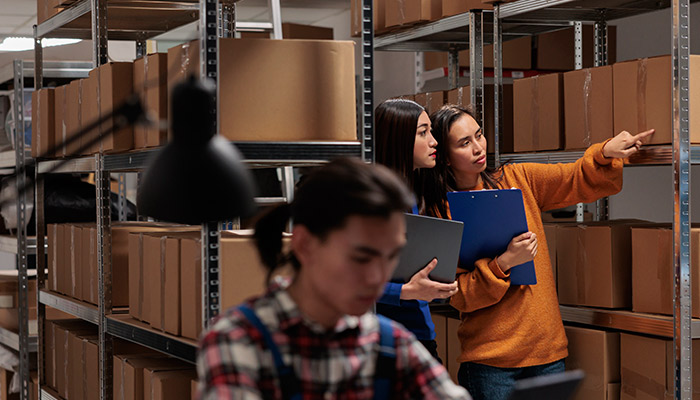 employees checking package packing quality