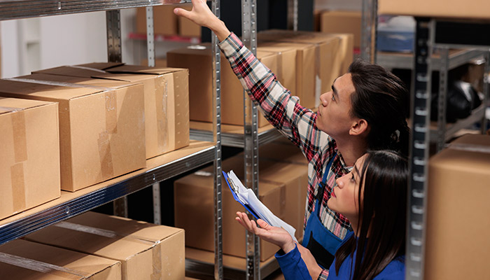 Warehouse managers checking orders list