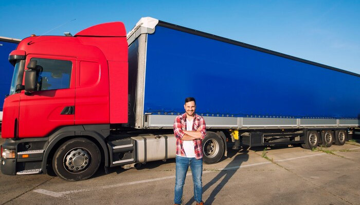 trucker in front of the truck