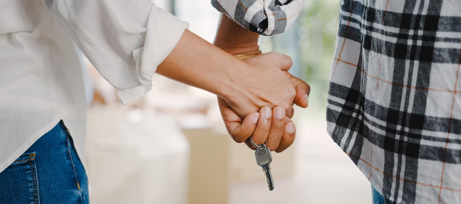 couple holding house keys