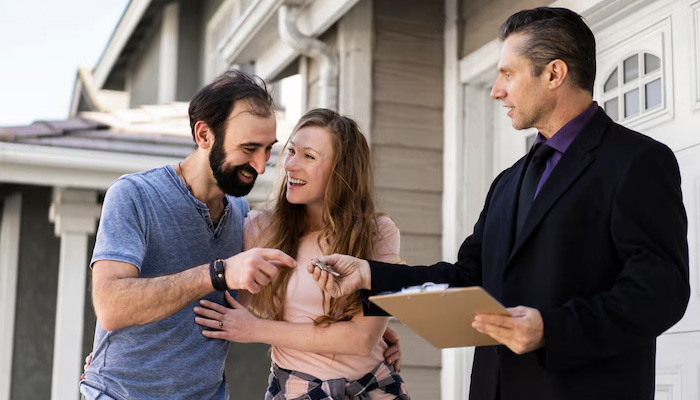 couple signing papers for new house