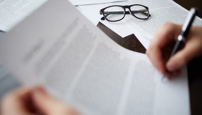 glasses on the documents