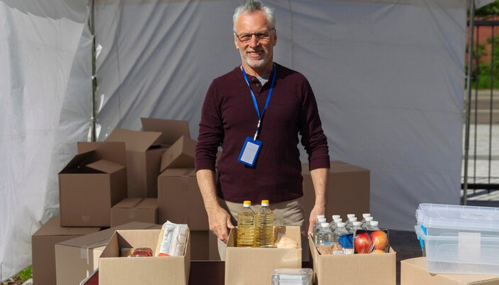 man standing under pop up storage tent