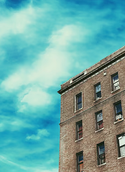 Brown concrete building under blue sky during daytime