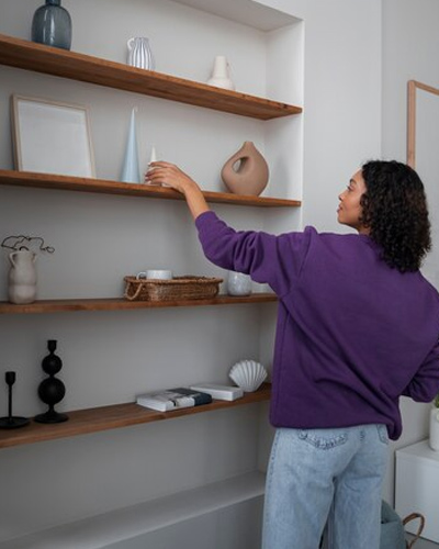 woman arranging decorations