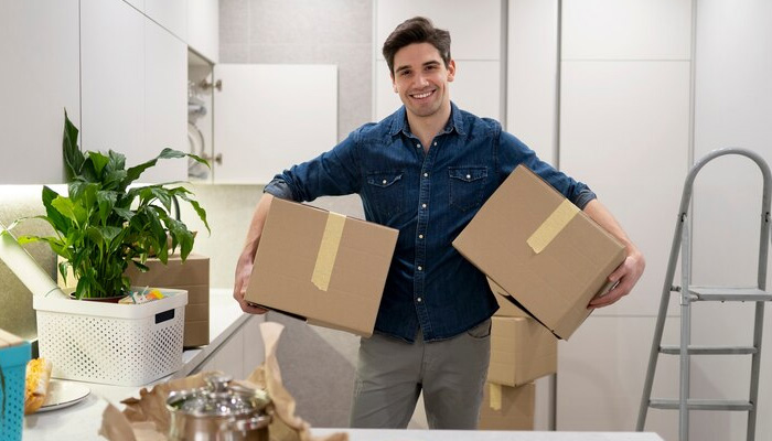 a man handling two boxes