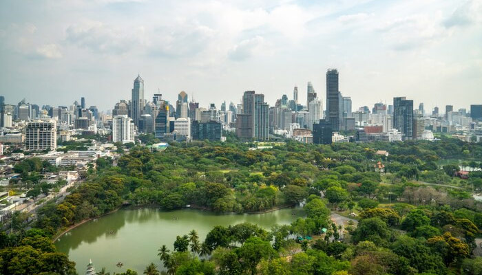 City park with greenery and surrounding high-rise buildings