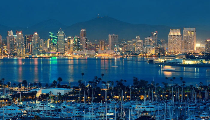 San Diego downtown skyline at night with boat in harbor