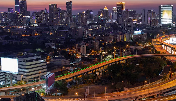 Beautiful city with lights close to its busiest highway at night